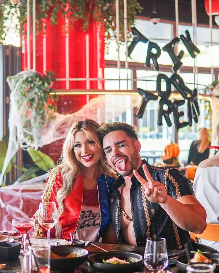 Guests in Halloween costumes at Cargo brunch, under Trick or Treat balloons